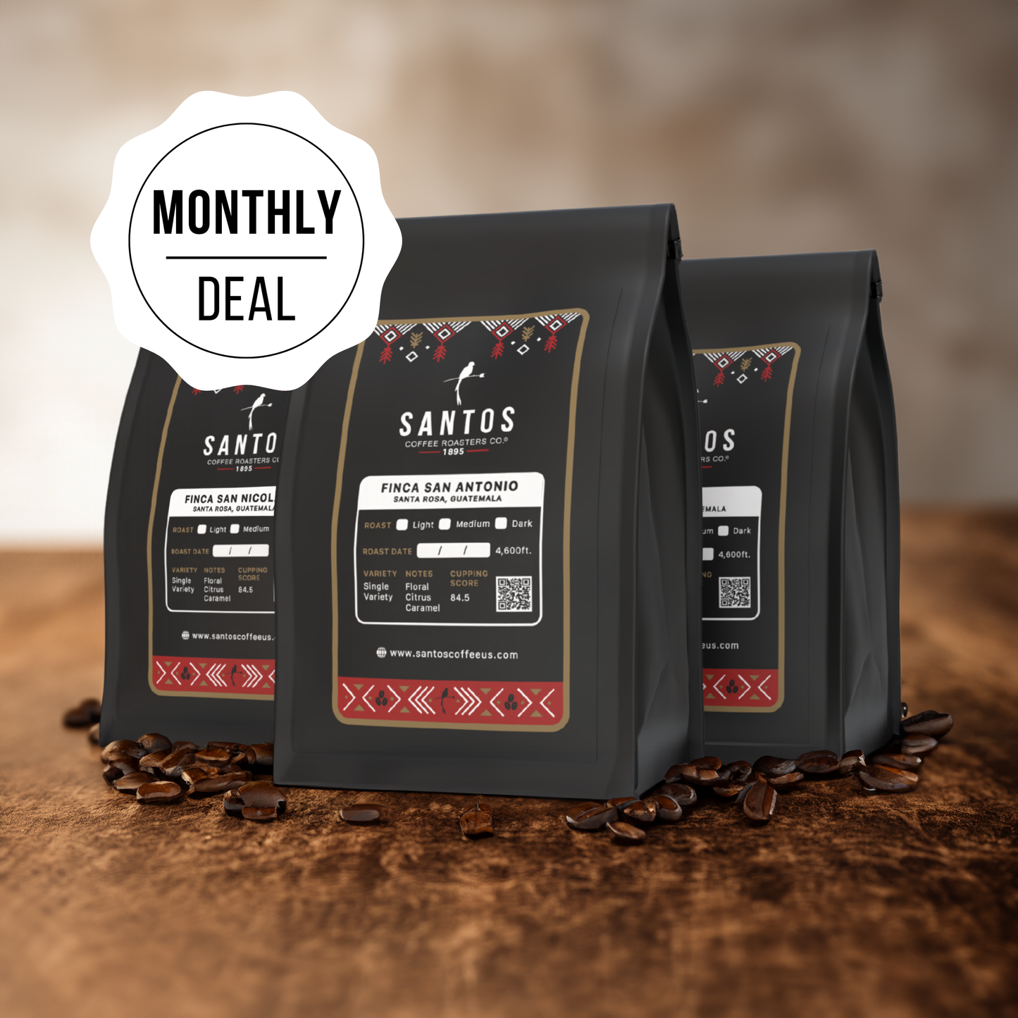 Santos Coffee Monthly Deal showing three coffee bags, with ground coffee, beans, and rustic textures on a wooden table.