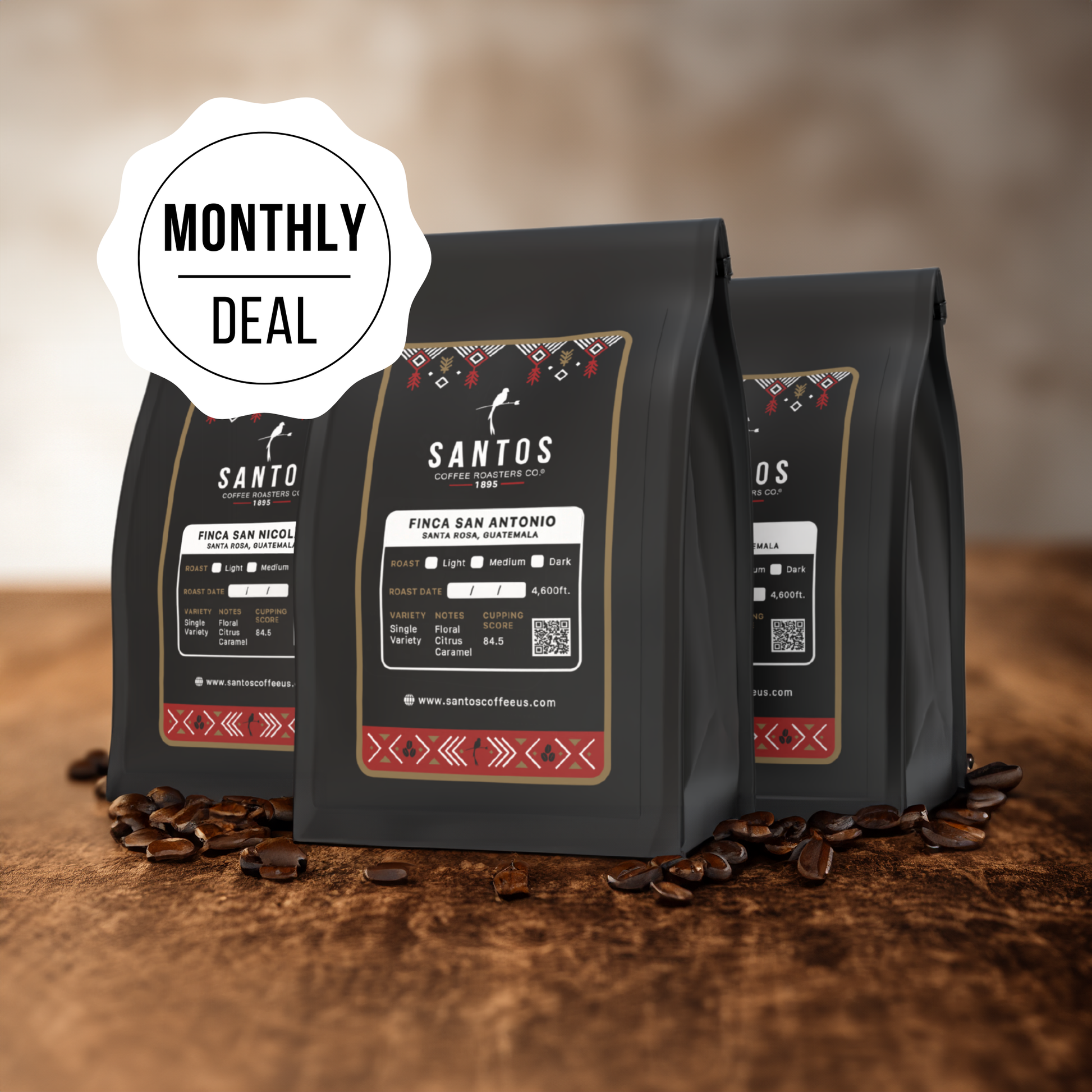 Santos Coffee Monthly Deal showing three coffee bags, with ground coffee, beans, and rustic textures on a wooden table.