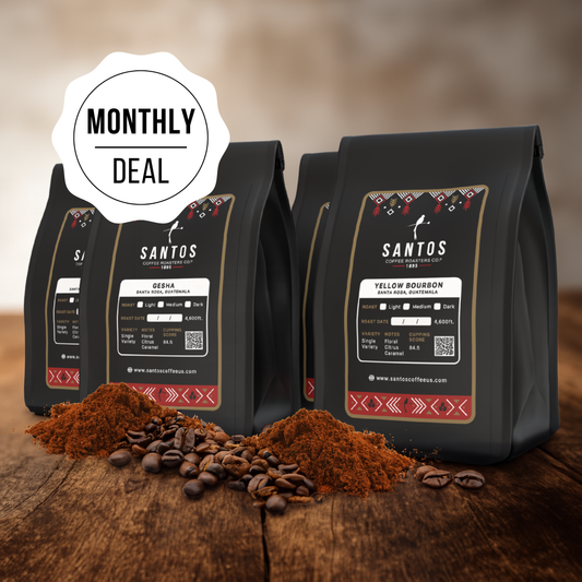 Santos Coffee Monthly Deal showing four coffee bags, with ground coffee, beans, and rustic textures on a wooden table.