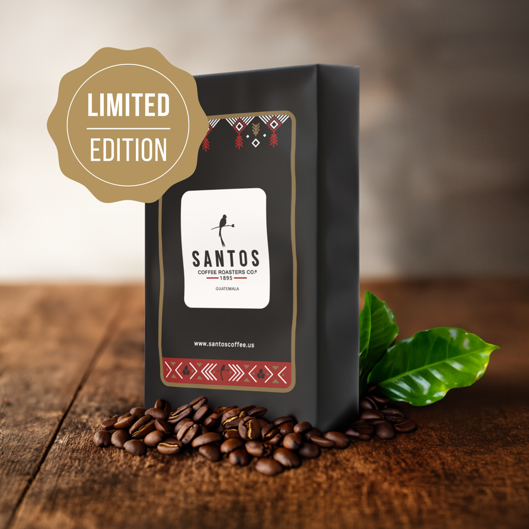 Santos Coffee “The Big Bag” Limited Edition, featuring a large coffee bag surrounded by roasted beans and fresh coffee leaves on a rustic wooden table.